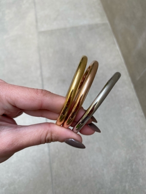 Trio di braccialetti metallici